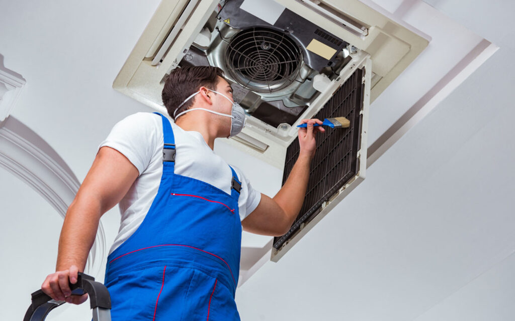 man repairing air conditioner 1024x640